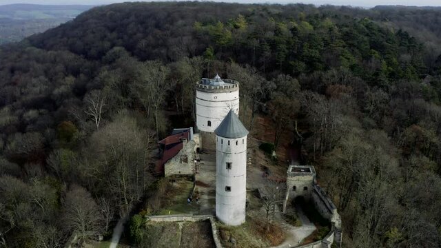 The fairytale castle burg Plesse in Bovenden near G&ouml;ttingen Goettingen at sunrise, Lower Saxony, Germany. Drone aerial shot of the Plesseburg in late autumn.