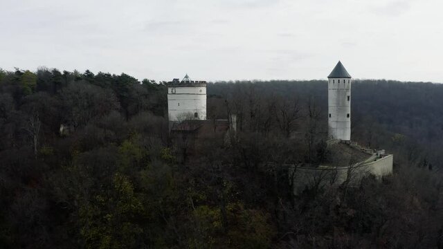 The fairytale castle burg Plesse in Bovenden near G&ouml;ttingen Goettingen at sunrise, Lower Saxony, Germany. Drone aerial shot of the Plesseburg in late autumn.