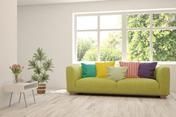 White living room with sofa and summer landscape in window. Scandinavian interior design. 3D illustration