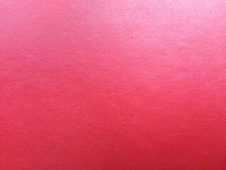 Textured glowing red with iridescent abstract background. The pattern of the surface of the skin.