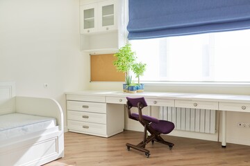 Pastel light interior of child's room for girl, white furniture