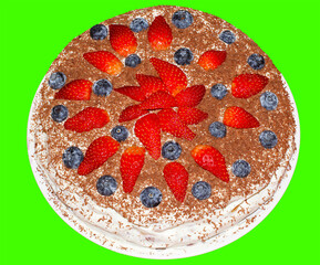 Handmade cake with strawberries and blueberries sprinkled with chocolate chips.