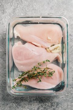 Chicken Breasts Brining With Fresh Thyme