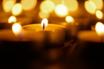 Burning candles. Shallow depth of field. Many christmas candles burning at night. Abstract candles...