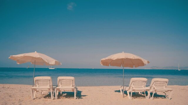 Sunchairs prepared for tourists on beach resort