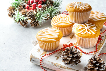 Christmas or New Year homemade sweet present mini cakes with icing sugar. Festive decoration.