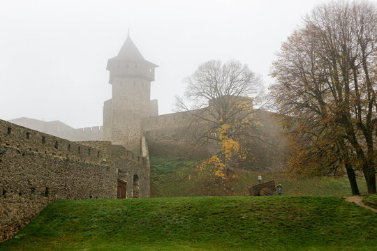 old tower of medieval Helfstyn fortress in Czech republic in autumn morning mist