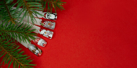 Christmas nail picture .  Christmas flat lay  on red bachground . beauty salon concept .