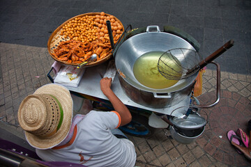 High angle shot of a mobile street food point with a cooker