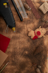 Christmas gifts and symbols over wooden background, handmade  toys from felt with own hands. Backgrond.