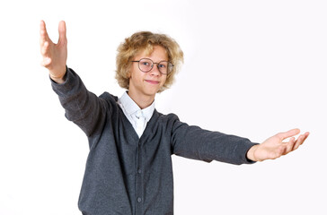 Teen boy showing a gesture by opening his hands. Isolated over white background.