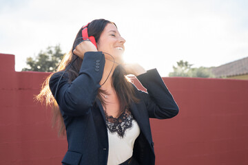 beautiful woman dancing with music headphones