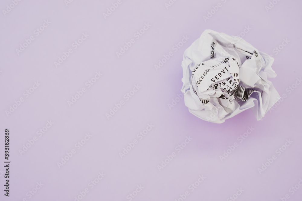 Canvas Prints High angle shot of a wrapped paper ball isolated on a violet background