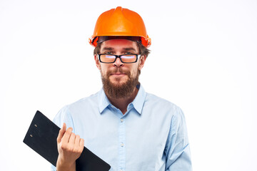 Emotional man in orange paint documents construction Manual drawings engineer