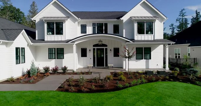 Beautiful white farmhouse style luxury home. Video moves upward.