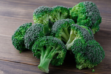  A lot of broccoli for diet and healthy eating. Fresh green broccoli on a   table.Broccoli vegetable is full of vitamin.Vegetables for diet and healthy eating.Organic food.