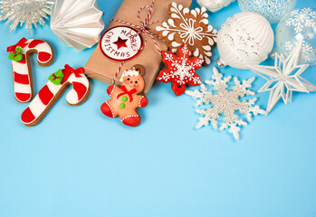 Christmas decor white and gingerbread on a blue background.