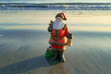 Santa Claus on sea beach. Happy New Year and merry Christmas travel, tropical vacations concept.