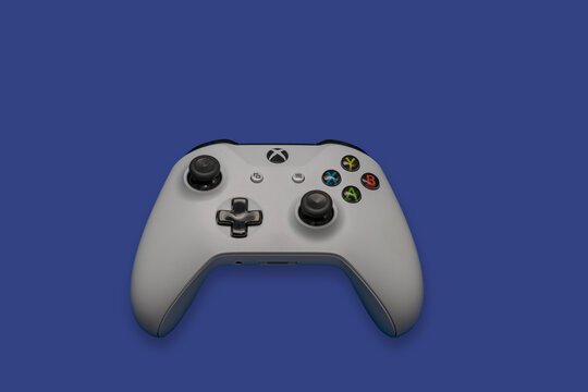 control of the xbox video game on the blue background panel.
