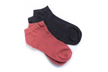 two pairs of colored short socks on a white background, top view
