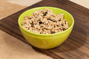 Healthy food; Crunchy granola sweetened with honey, has raisins.