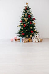 Christmas tree pine with decorations and gifts new year December