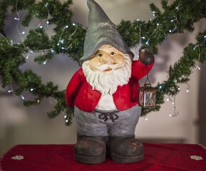 Close up view of cute gnome figure on christmas decoration background. Christmas holidays concept.