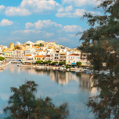 Fototapeta na wymiar view from the hill to a quiet bay with boats in the Greek resort town of Agios Nikolaos