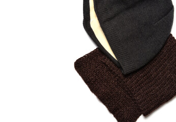 brown woolen scarf and gray cotton winter hat on a white background.