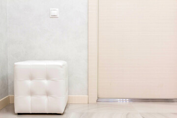 white leather ottoman in a modern style