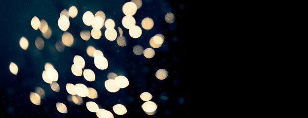 Magical Christmas - defocused, abstract, shiny golden fairy lights with magnificent bokeh effect....