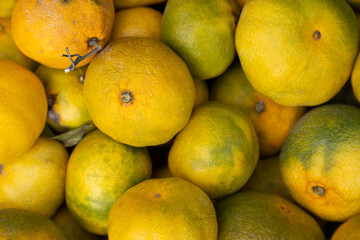 Organic market fresh tangerine background. Close up on a farmers market fresh tangerines.