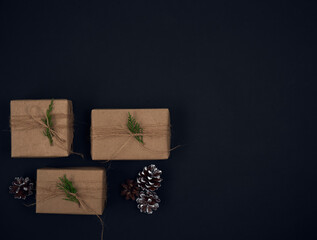 Christmas gifts with christmas decoration on black background.