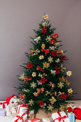 Christmas tree pine with new year gifts holiday red decoration decor gray background