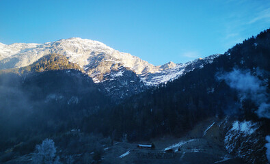 Obraz premium snow covered mountains and blue sky in winter