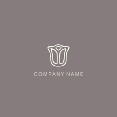 A symbol or logo of a simple, minimalistic, stylized tulip or flower bud shape, composed of several elements. Made with a thin contour line.
