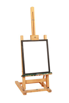 Closeup of a wooden molbert with a paper attached to it isolated on a white background