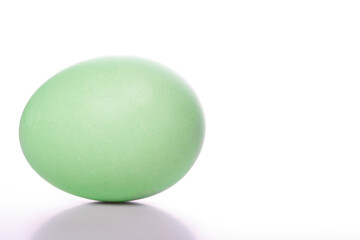 Green easter egg on white background