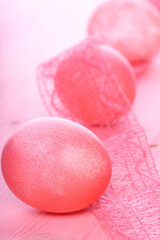 Easter eggs on pink background