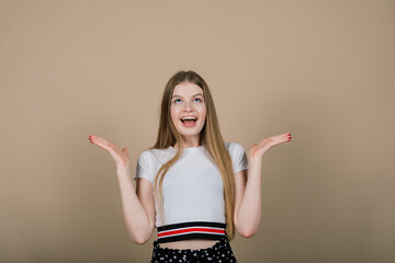 Emotional portrait of surprised woman. Amazement emotion. Studio isolated shooting.