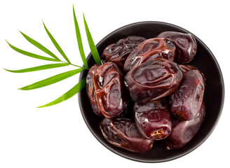 date fruit in black bowl isolated on white background. top view
