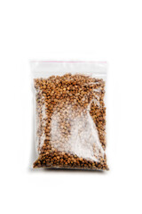 Spinach seeds in germination bag on a white background