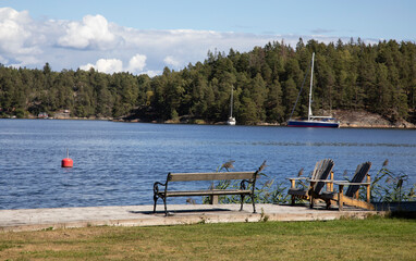 
Benches by the lake on a summer day