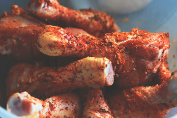 spicy uncooked chicken drumsticks