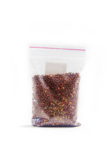 Chinese radish seeds in a package for germination on a white background