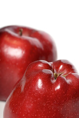 Close-up of red apples on white background