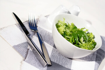 Studio shot of lettuce in white bowl