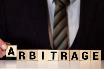 ARBITRAGE word made with building blocks