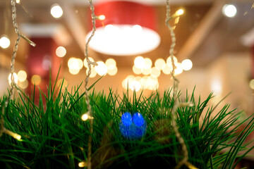The cozy interior of the cafe with festive garlands. Warm light, lights of the New Year holiday