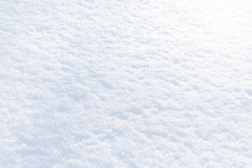 White snow winter texture. Christmas holiday background. Seasonal fresh white color snow nature backdrop wallpaper. First frost. Crisp shiny textured ice frosty snow on sunny day outdoors.